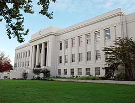 Linn County courthouse, a 3 story white marble building.