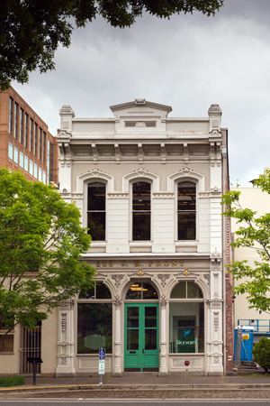 Two-stroy building with tall windows on both floors.