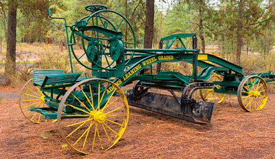 A horse-drawn scraping grader