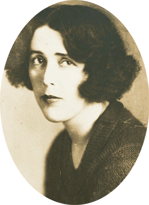 Photo of Louise Bryant with dark hair, cut just below ear length.