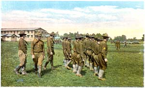 Army recruits outside on lawn practicing drills.