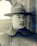 Austin Case in a wide brim hat and overcoat