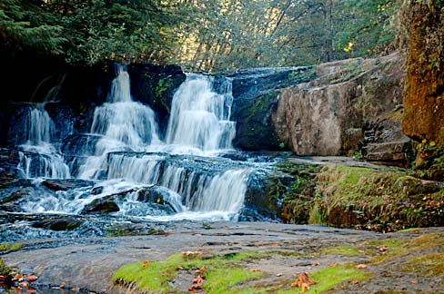 Water falls over rock