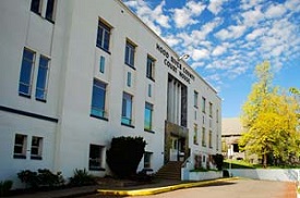 Hood River County Courthouse, a 3 story building with pavement in front.