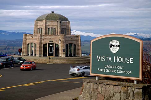 Vista house has a dome roof and a sign out front says "Vista House Crown Point"