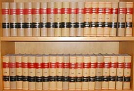 Two wooden bookshelves holding 18-20 books each. 