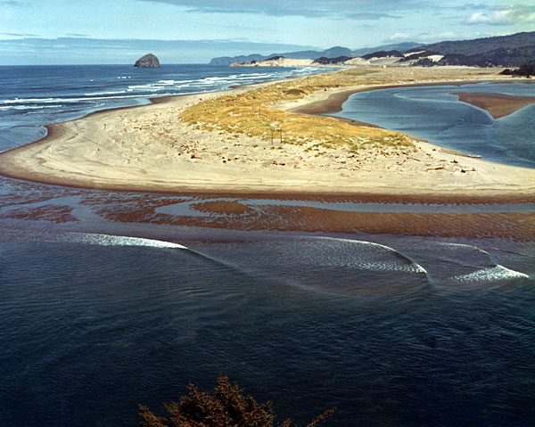 A small piece of land juts out into the water. 