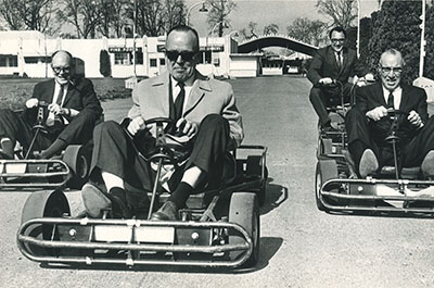 Men drive go-karts