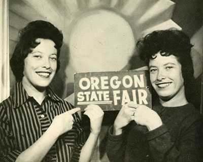 Twin sisters pose at the State Fair