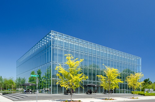 Glass structure. Described by the architect as resting on a table of water and a birch forest celebrating regional environment