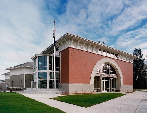 Fairview city hall exterior is red brick with an archway dominating the front entrance.