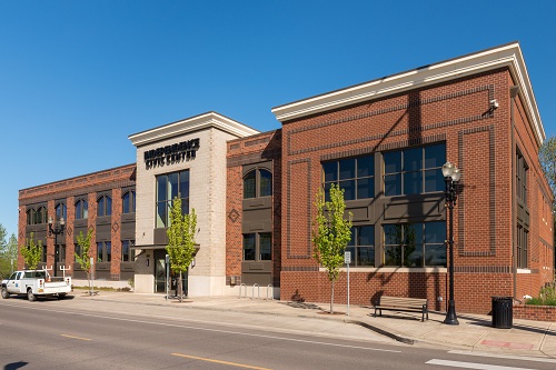 The 2-story Civic Center building exterior is clad in brick, precast concrete, decorative concrete masonry units, metal panels. 