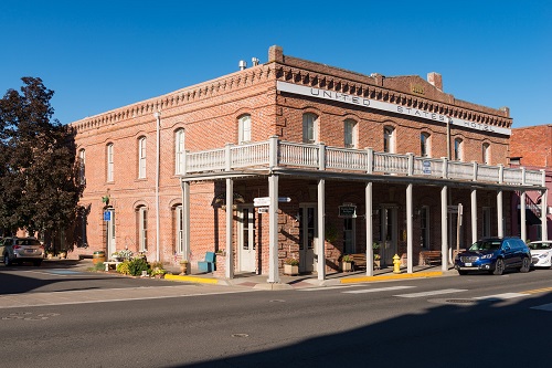 Exterior view of U.S. Hotel. A brick, 2-story commercial Italianate stryle structure built between 1878 and 1880.