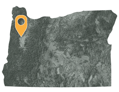 Oregon map with black and white circles documenting location of the confederated tribes of Grand Ronde