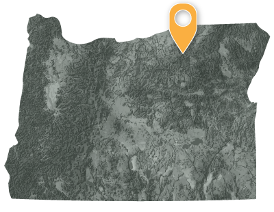 Oregon map with black and white circles documenting location of the confederated tribes of the Umatilla Indian Reservation